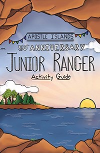 Cover of the Junior Ranger Book, showing blue water, and rocky shorelines.