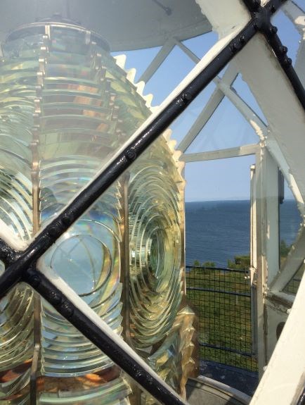 Devils Fresnel view through lantern_resize Looking at a fresnel lens through windows of the frame.