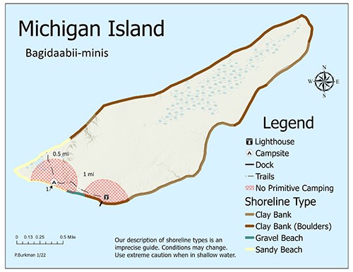 A map of Michigan Island showing trails, shoreline, topography, and primitive camping zones.
