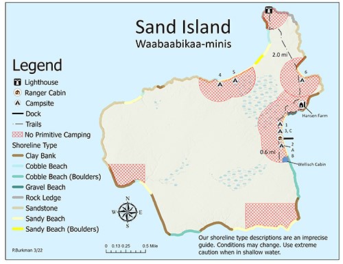 A map of Sand Island showing trails, shoreline, topography, and primitive camping zones.