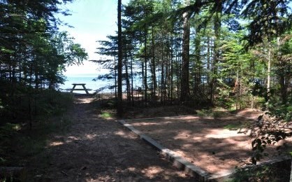 Tent pad and picnic table at Stockton Island campsite six, overlooking Lake Superior.