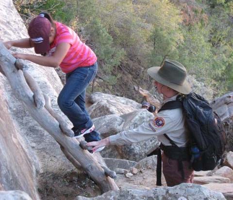 Outdoor education volunteer with student