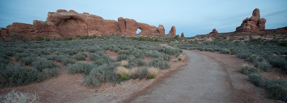 a hard trail leads to a large stone arch a hard trail leads to a large stone arch