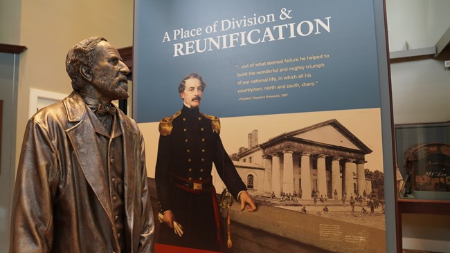 A statue of Robert E. Lee and the words Division and Reunification