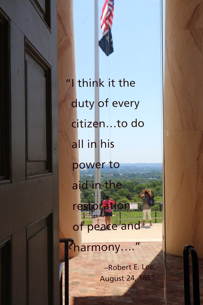 A quote written on a window looking outside.