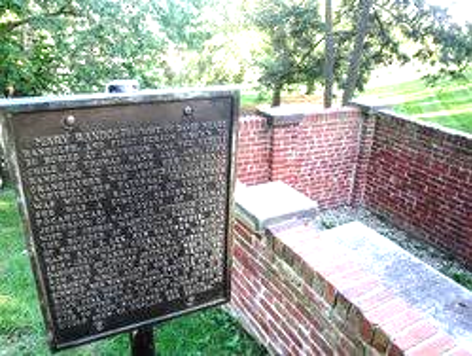 Image of sign next to grave stone