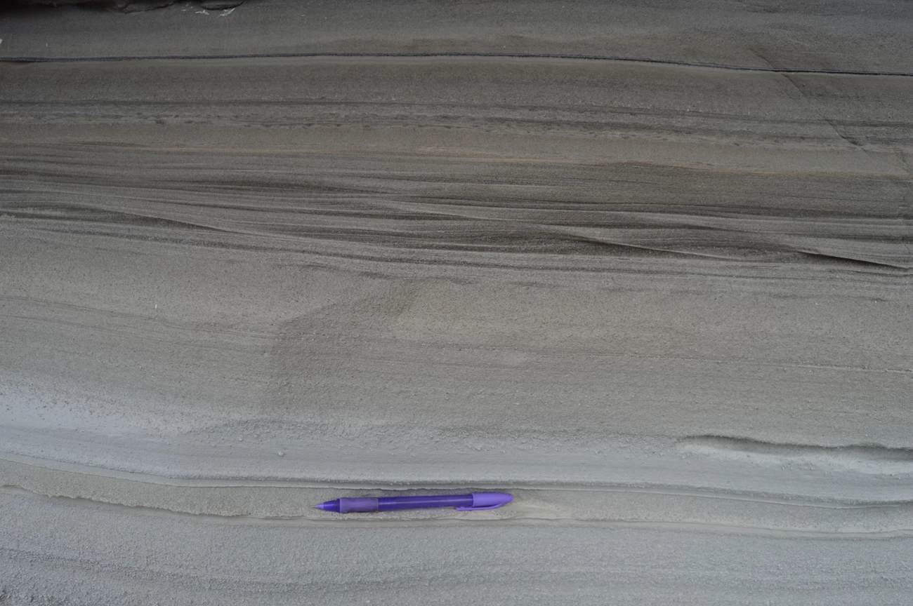 -mt photo of fine-grained volcanic ash exposed on a hillside