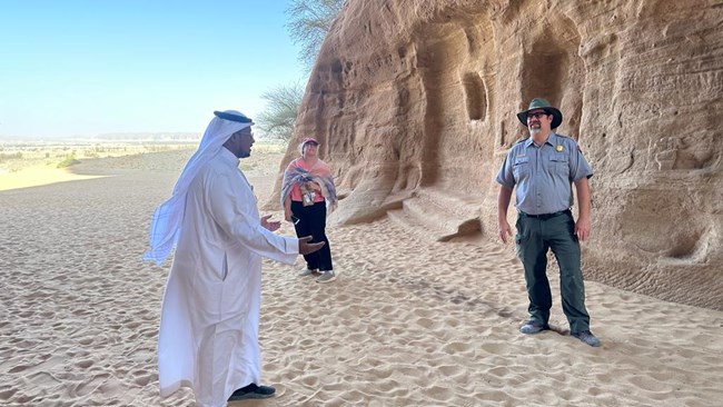 Superintendents Lynne Dominy and Scott Tucker listen to a Saudi Interpretive Specialist.