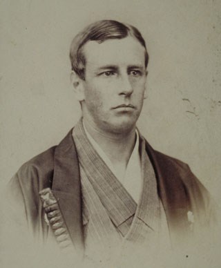 Charles Longfellow dressed as samurai Young white man in head-and-shoulders portrait, wearing kimono