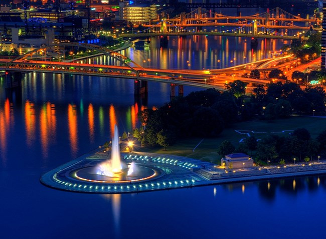 fountain and rivers with lights at night