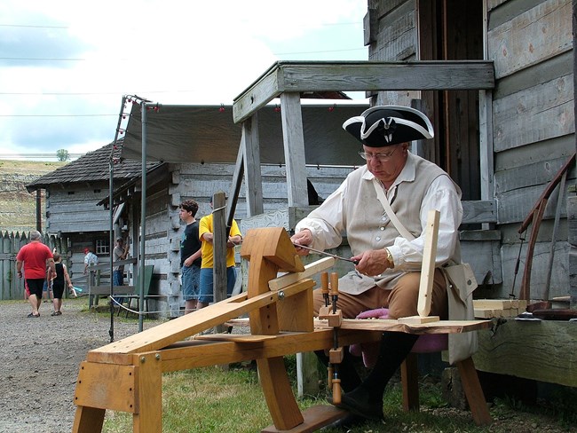 1171 historic actor outside wooden fort