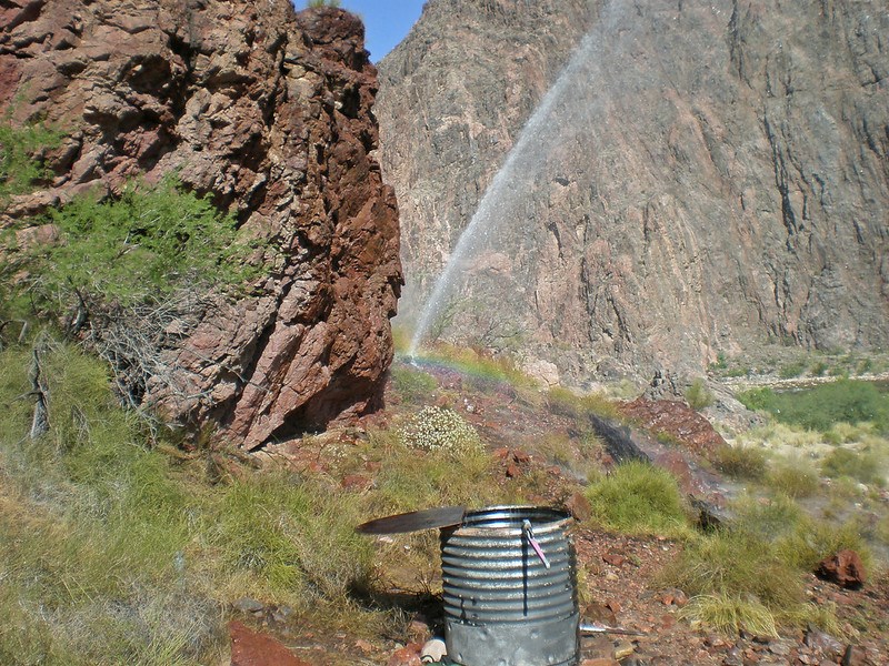 Rainbow visible from water spraying from a break in the Trans-canyon Waterline along the North Kaibab Trail