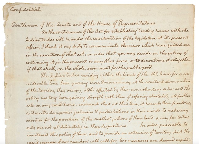 The top half of page one of Thomas Jefferson’s handwritten letter to Congress.  Faded brown ink on yellowed paper.