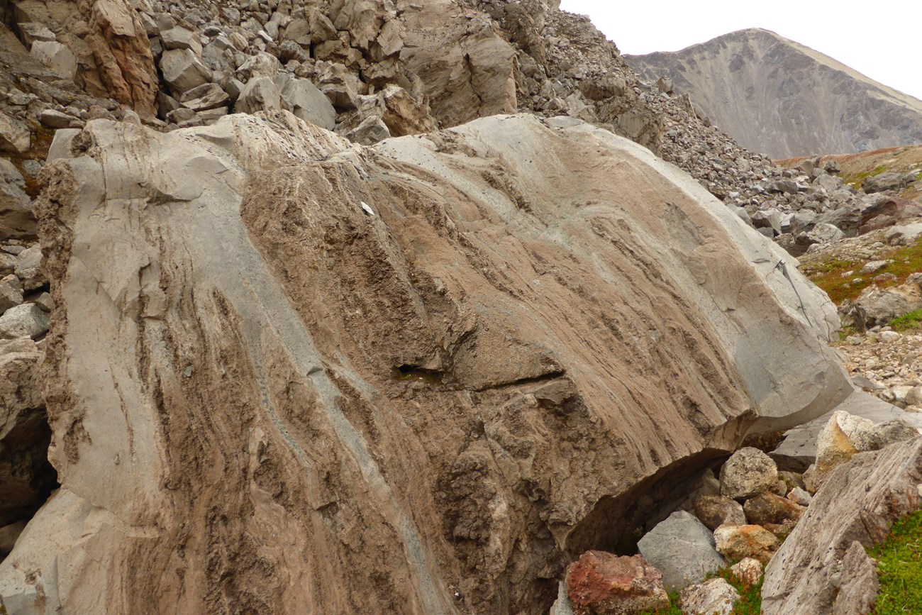 photo of boulders showing banded color and texture