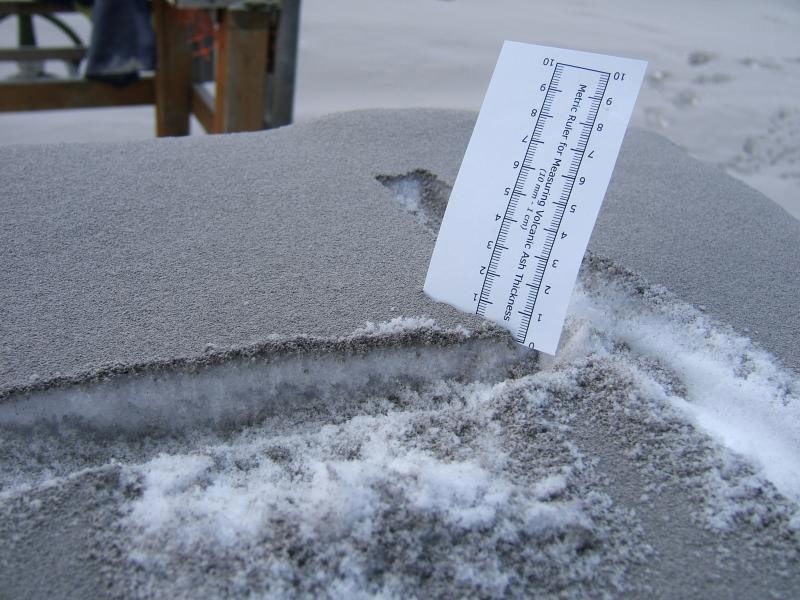 photo of snow with a layer of ash on top