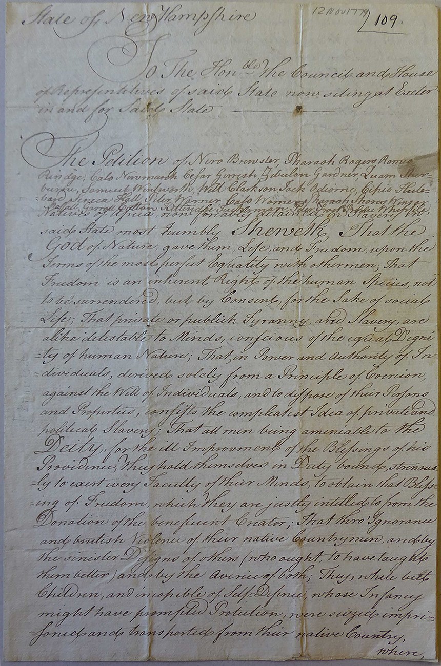 Handwritten petition for the abolition of slavery in the state of New Hampshire in 1779. handwritten text on yellow page