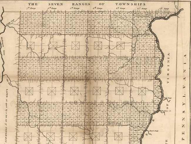Black-and-white map showing river and land in square parcels with numbers on them.