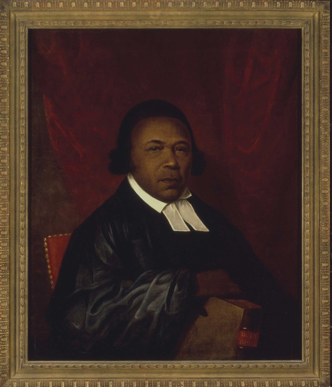 Reverend Absalom Jones in his ecclesiastical robes, with Bible in hand. Half portrait of a Black American man in robes and Bible in his right hand.