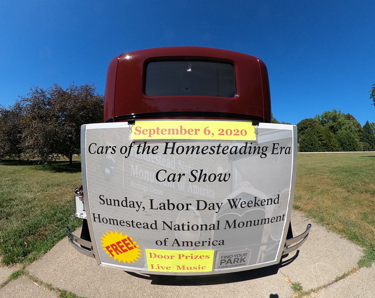 Restored 1931 Model A with a banner advertisement on the back