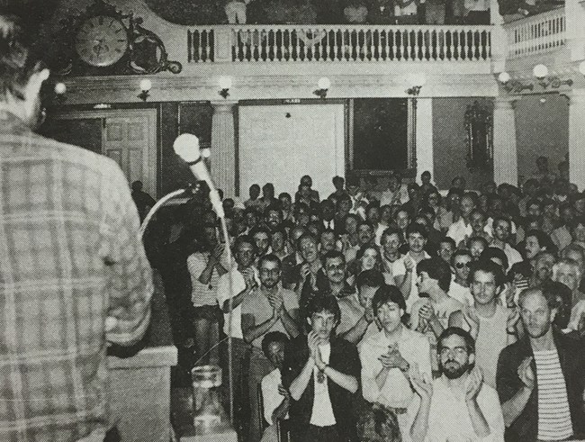 1983 - Town Meeting - Susan Fleischmann Speaker looking out to the crowd at Town Meeting in Faneuil Hall.