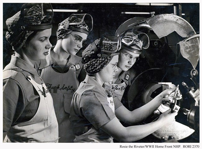 Training day. Four women with safety gear training during a work day.