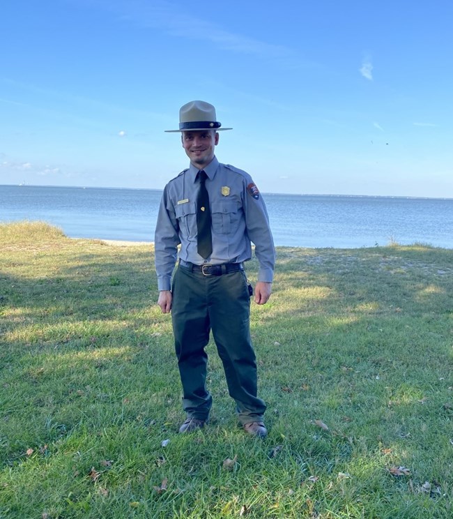 ranger in NPS uniform in front of the Potomac River