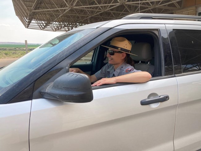 A ranger drives a vehicle
