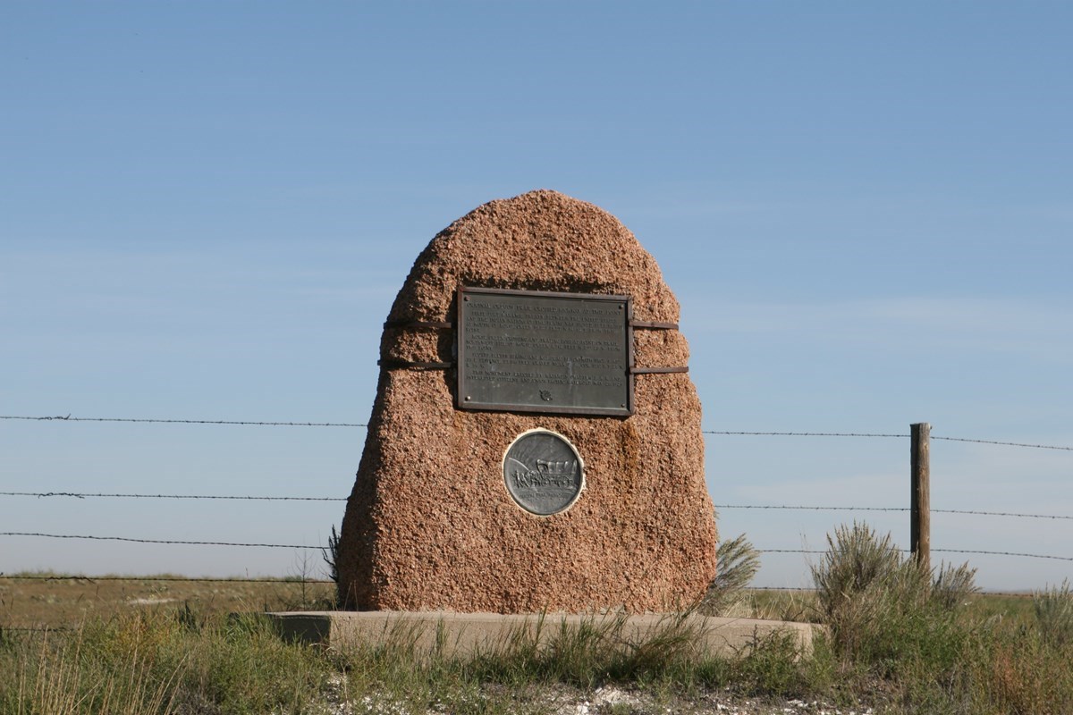 Stone marker with a plaque