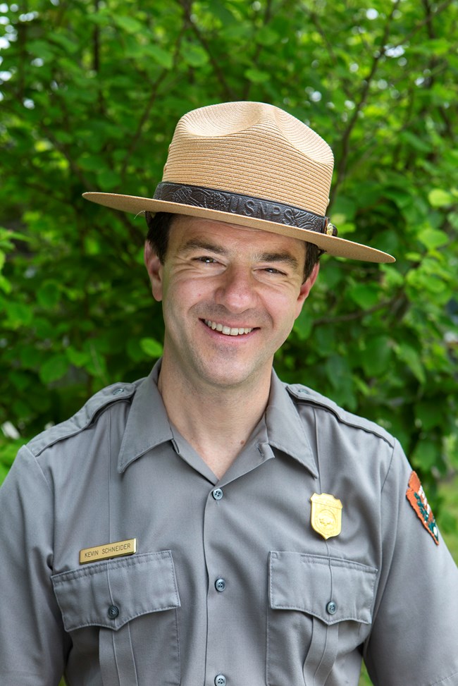 Portrait of a smiling map wearing a park ranger flat hat Portrait of a smiling map wearing a park ranger flat hat