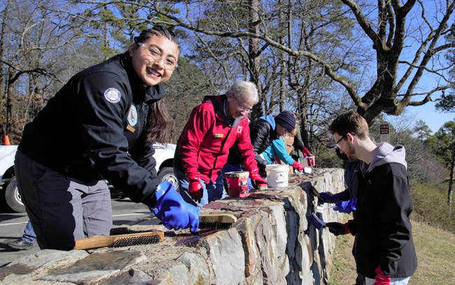 2022 MLK Event A photo of volunteers conducting graffiti removal at Hot Springs National Park.