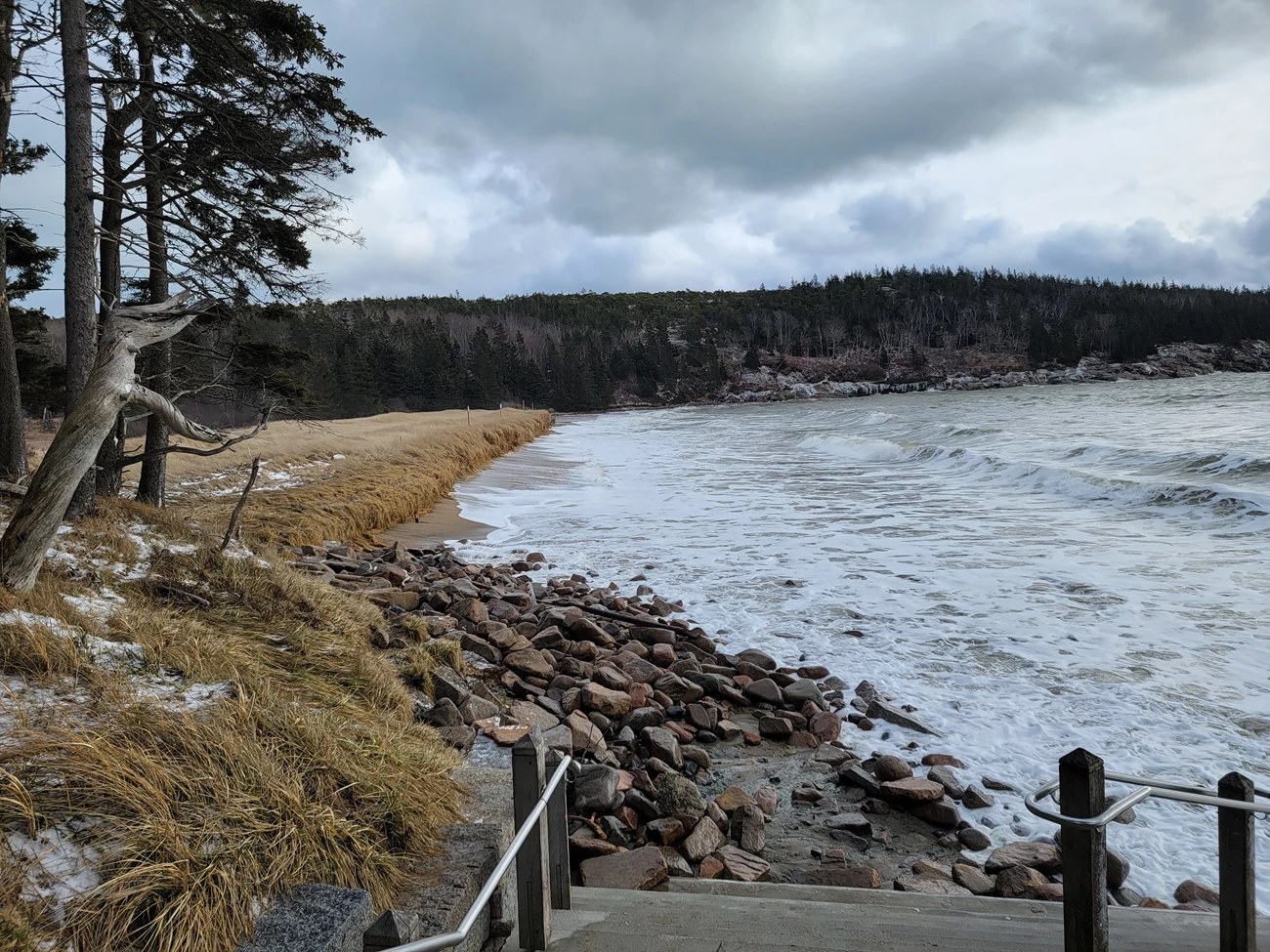 Rising tides can affect structures. A rising tide at a cloudy seashore