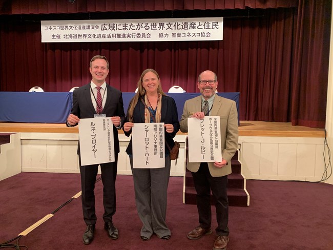 2023 Hokkaido symposium Sharlot Hart and Bret Rudy stand with one of the organizers of the event.