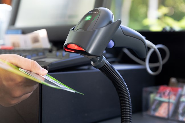 Fee staff scans a recently purchased park pass.