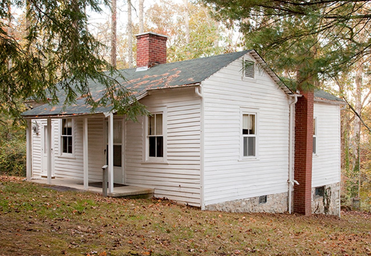 22 tenant house A small white house with front porch and two entrance doors