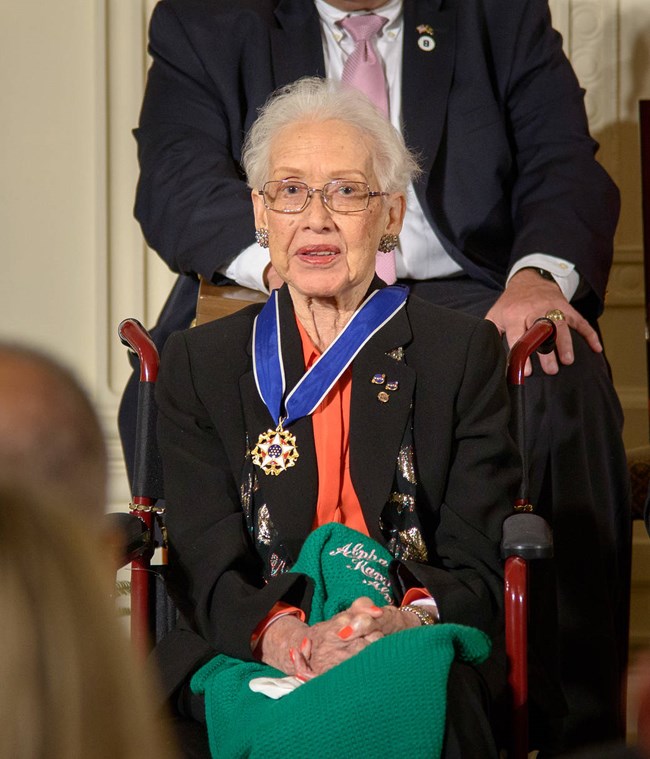 Photo of woman who just received medal.