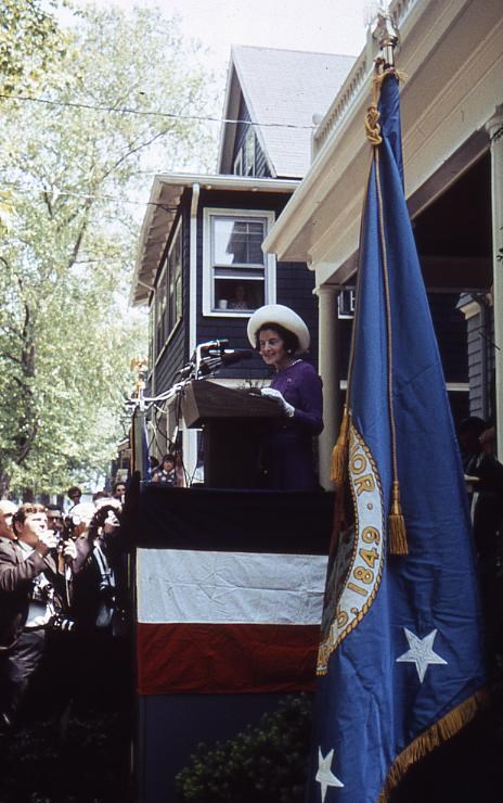 Rose Kennedy stands at podium