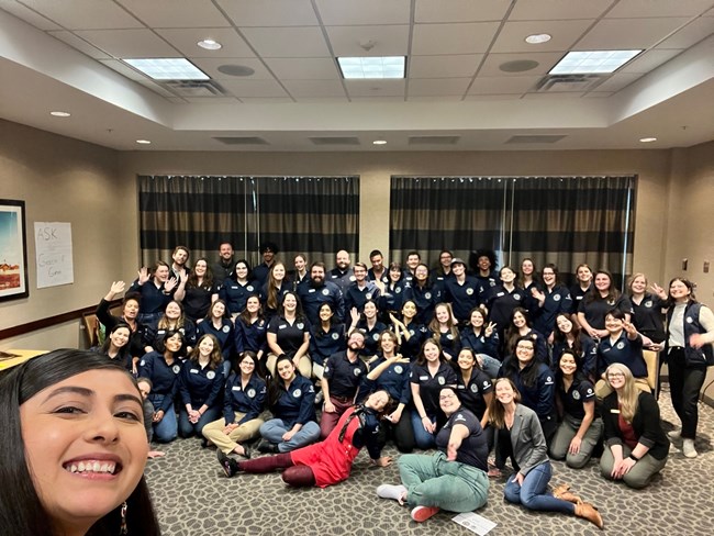 Community Volunteer Ambassador Program A photo group selfie of interns and staff at the National Early Service Training.