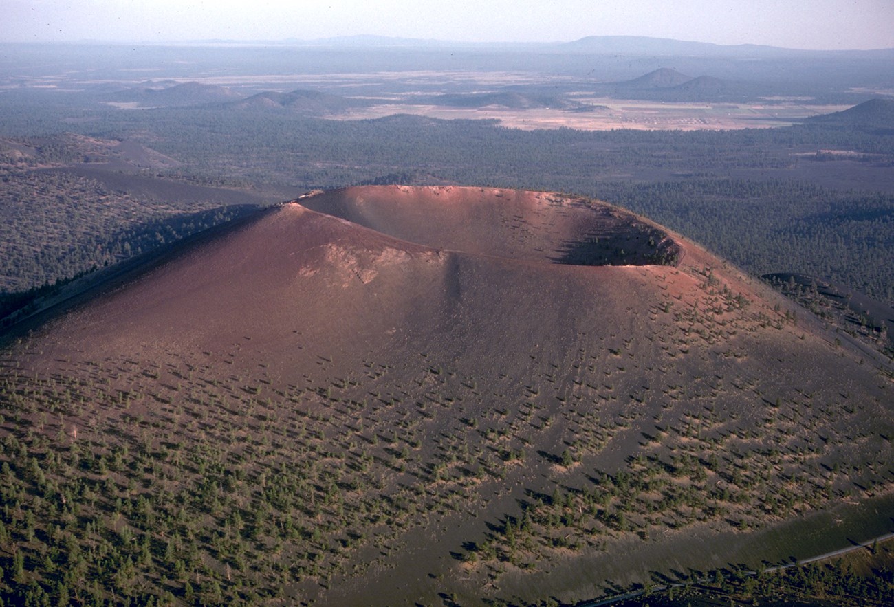 aerial photo of a cinder cone with a large summit crater