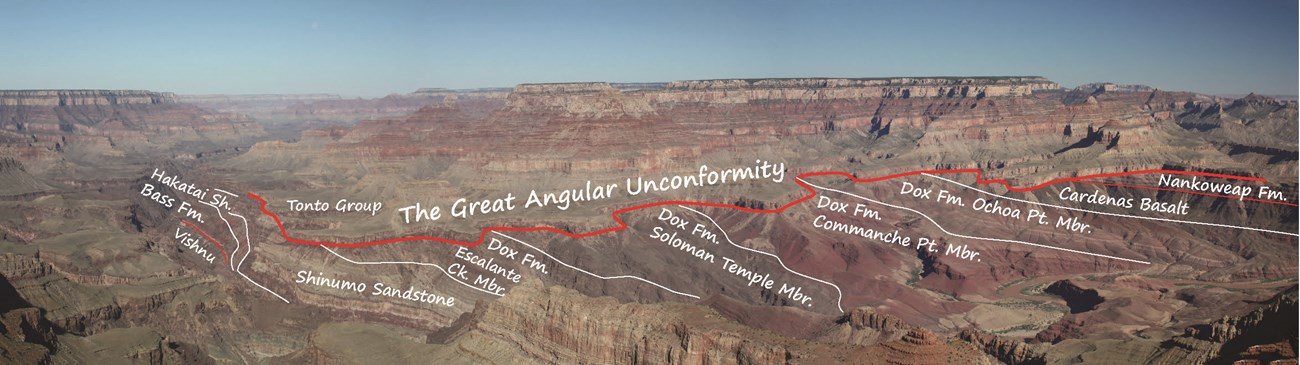 Photo of a canyon with exposed rock layers.