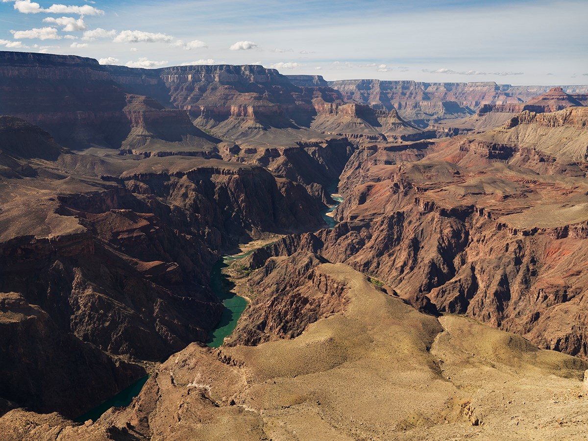 Photo showing grand canyon cliffs, mesas, and rock layers.