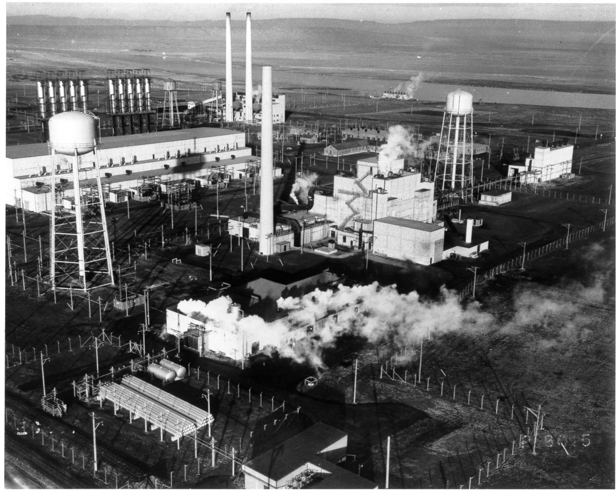 Aerial photo of plutonium reactor complex with buildings and stacks