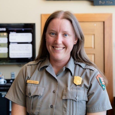 Coordinating Research Permits a park ranger in uniform and smiling at the camera