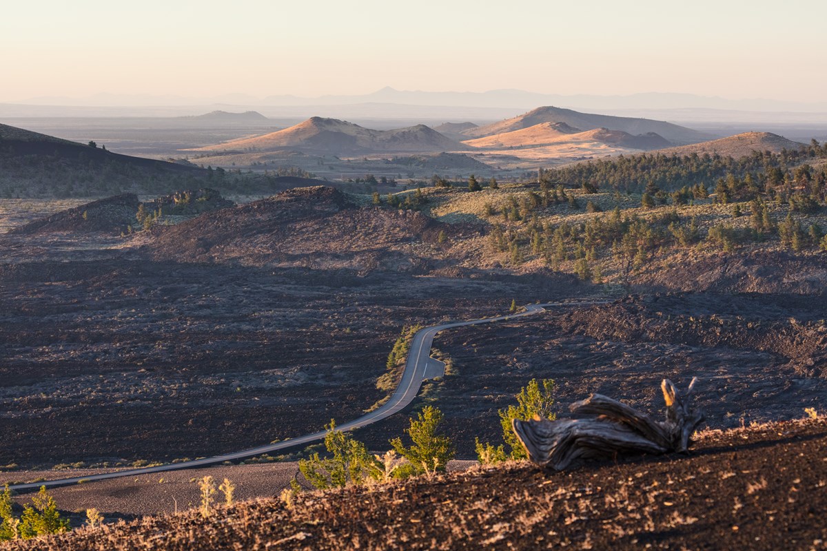 The park road winds through a beautiful landscape of lava and cones.