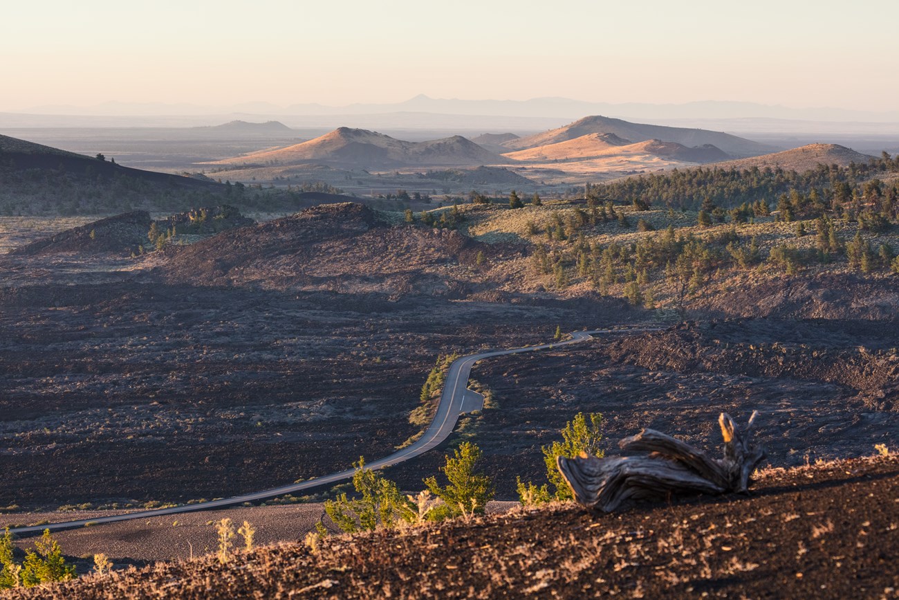 The park road winds through a beautiful landscape of lava and cones.