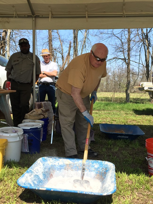Jimmy Price mixing quick lime at a NCPTT workshop. Jimmy Price mixing quick lime at a NCPTT workshop.