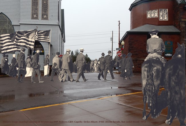 Historic photo overlay of the 1913 Strike Parade. There are people marching with flags and two people on horses cut out and overlaid to a modern photo.