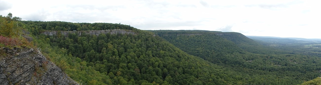 Panoramic view of green mountains
