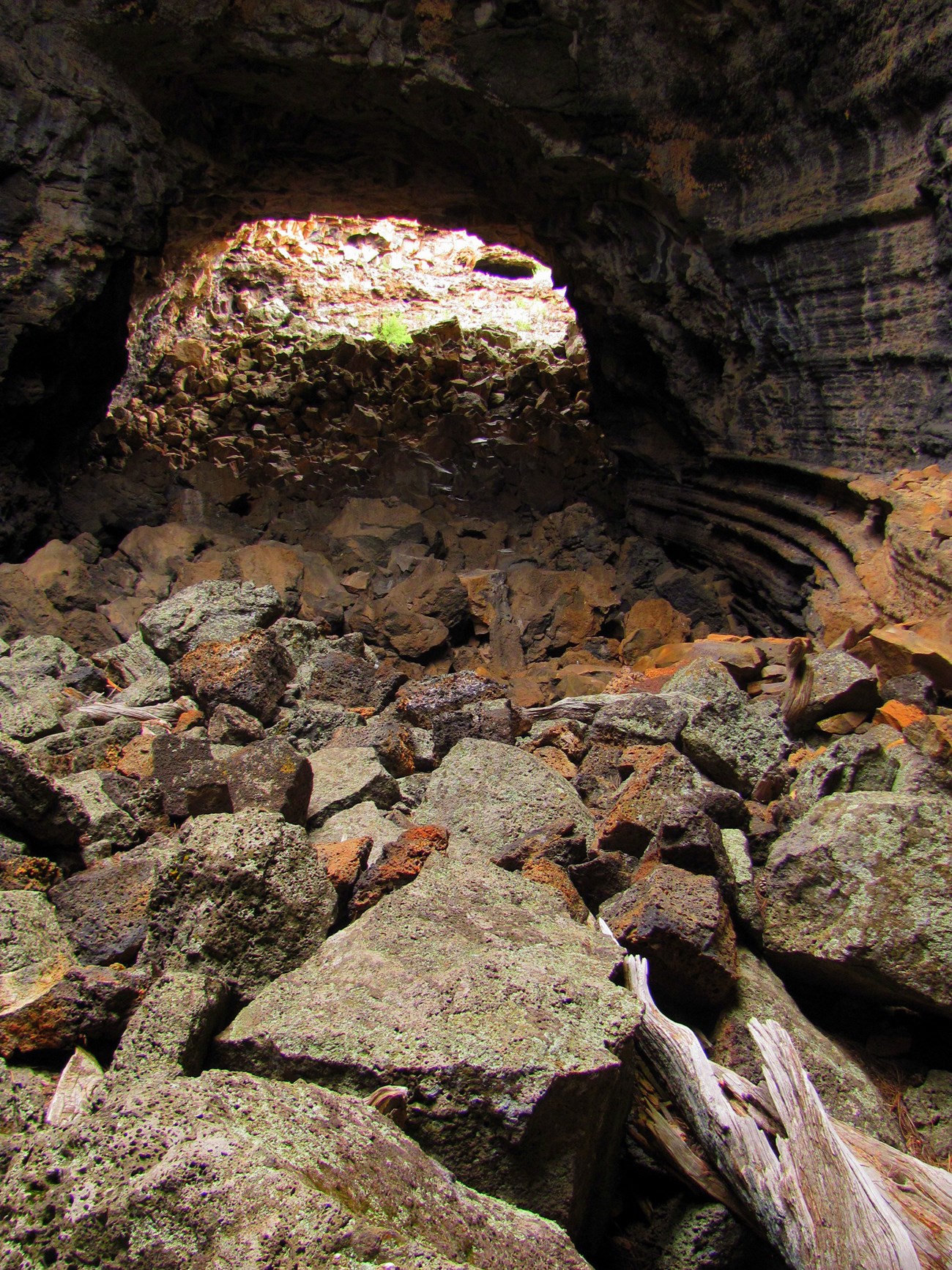 photo of a cave with block rock on the floor and ceiling