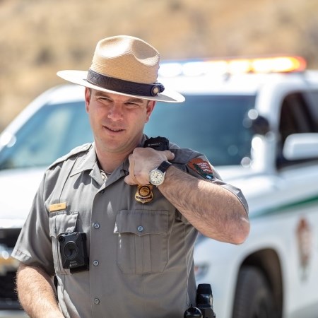 Patrolling Park Roads a park ranger talking on a radio