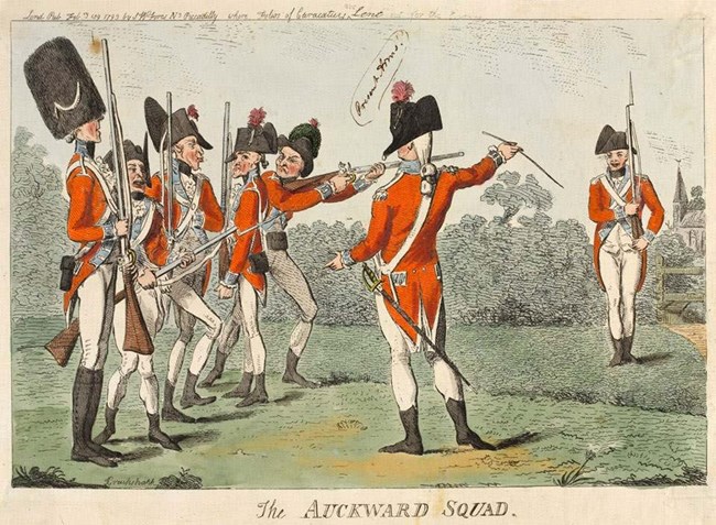 Seven soldiers in red coats with arms in a field